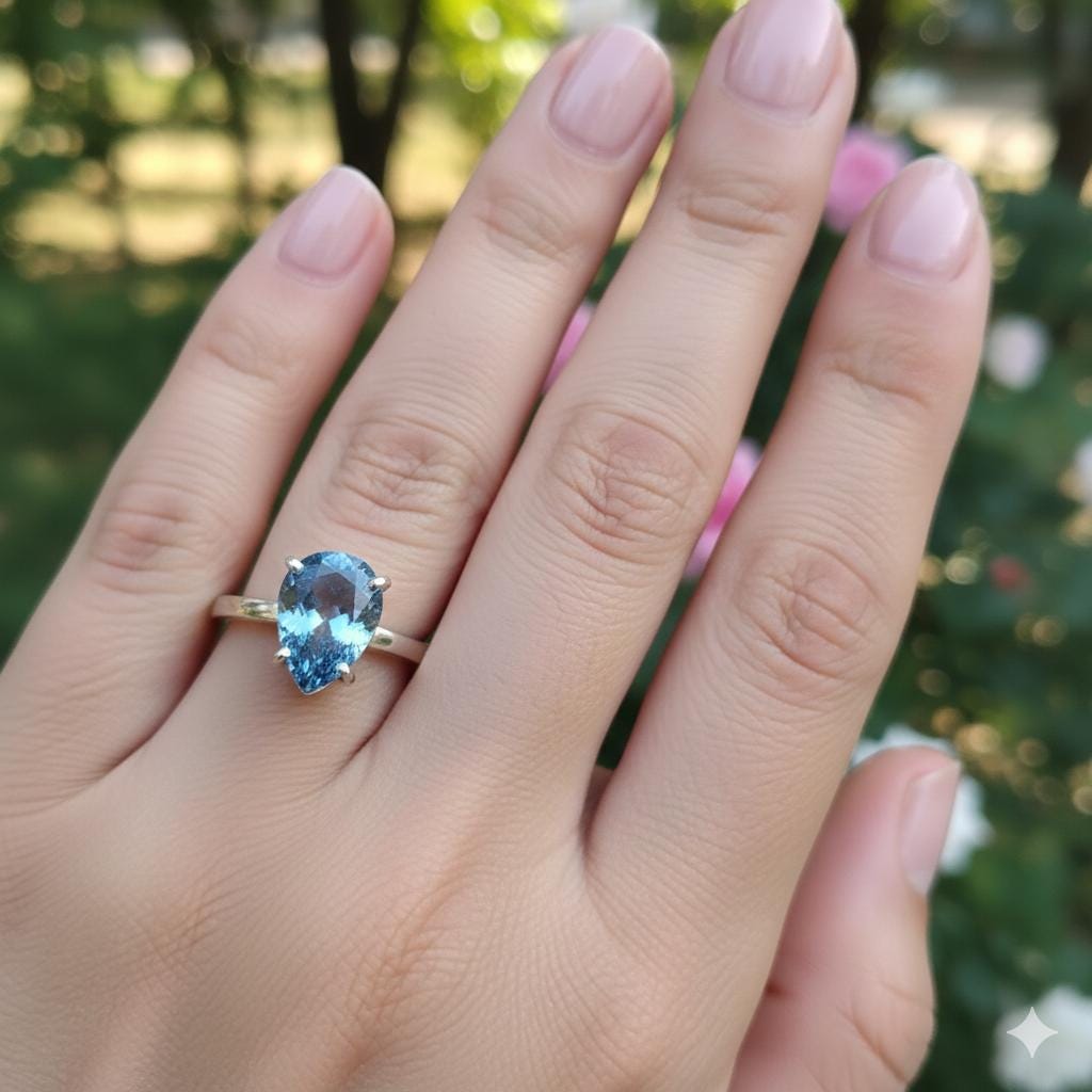 Pear Tanzanite Sterling Silver Ring, Prong Setting (7x9mm)