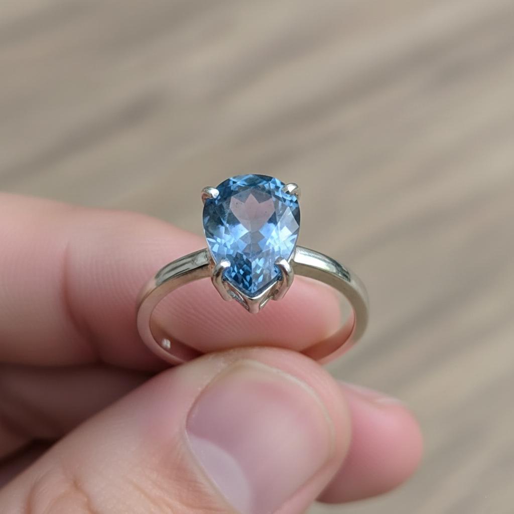 Pear Tanzanite Sterling Silver Ring, Prong Setting (7x9mm)