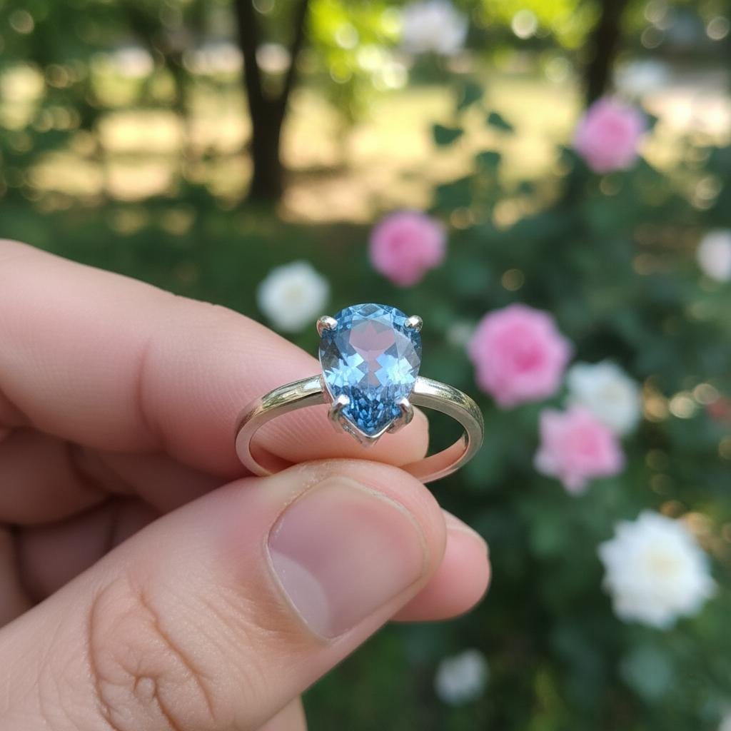 Pear Tanzanite Sterling Silver Ring, Prong Setting (7x9mm)
